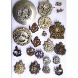 A COLLECTION OF TWENTY EARLY 20TH CENTURY BRITISH ARMY CAP BADGES Including Scottish Liverpool,