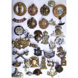 A COLLECTION OF THIRTY EARLY 20TH CENTURY BRITISH ARMY CAP BADGES Comprising Royal North Lancashire,