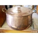 A LARGE VICTORIAN COPPER COOKING OVAL PAN AND COVER With twin handles and tin lined interior. (