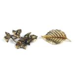 TWO VINTAGE 9CT GOLD LEAF BROOCHES The branch with four leaves and a single leaf. (approx 5cm)