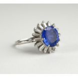 AN 18CT WHITE GOLD, 2.5CT SAPPHIRE AND DIAMOND RING The oval cut sapphire edged with baguette cut