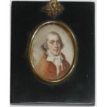A 19TH CENTURY OVAL MINIATURE PORTRAIT OF A GENTLEMAN Wearing a red coat and white tie. (11cm)