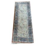 A MIDDLE EASTERN DESIGN RUNNER With organic designs on a beige ground. (65cm x 170cm)