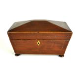 A GEORGE III MAHOGANY SARCOPHAGUS FORM TEA CADDY Decorated with ebony and boxwood rope stringing,
