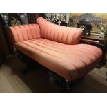 A VICTORIAN STYLE CHAISE LOUNGE Striped fabric upholstery, raised on turned legs With brass cup