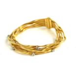 MARCO BICEGO, AN 18CT GOLD AND DIAMOND FIVE STRAND BRACELET Signed on clasp. (18cm, 30g)