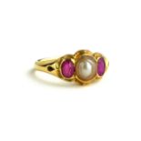 AN EARLY 20TH CENTURY YELLOW METAL, RUBY AND PEARL RING Having a single pearl flanked by oval cut