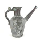AN ANTIQUE PERSIAN COPPER EWER/BODNA Having a scrolled handle and tapering form spout. (approx 28cm)