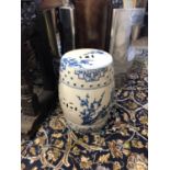 A PAIR OF CHINESE BLUE AND WHITE BARREL STOOLS Decorated with flora and Pagodas. (w 29cm x 45cm)