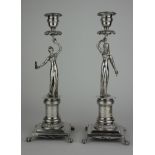 A PAIR OF 19TH CENTURY POTUGUESE FIGURAL SILVER CANDLESTICKS Classical male and female on