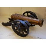 A HEAVY CAST BRONZE AND IRON MODEL TABLE TOP CANNON The cylindrical barrel cast with the Royal