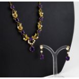 A 20TH CENTURY 9CT GOLD, AMETHYST AND SEED PEARL NECKLACE AND EARRING SET Having an arrangement of