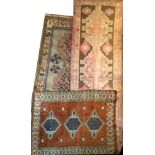 A TURKOMAN WOOLLEN RUNNER Along with two rugs. (runner 317cm x 109cm)