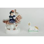 STAFFORDSHIRE, A 19TH CENTURY POTTERY FIGURE, YOUNG GIRL RIDING A GOAT Together with a recumbent