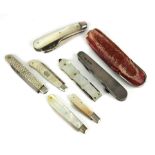 A COLLECTION OF SEVEN EARLY 20TH CENTURY SILVER AND MOTHER OF PEARL PENKNIVES Including a knife with