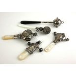 A COLLECTION OF EDWARDIAN AND LATER SILVER AND MOTHER OF PEARL CHILD'S RATTLE Comprising two figural