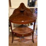 A GEORGIAN MAHOGANY BOW FRONTED CORNER THREE TIER WASHSTAND. (62cm x 40cm x 111cm)