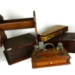 AN EDWARDIAN OAK AND BRASS DESKSTAND Having two glass in Wells and brass carry handle, together with