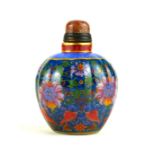 A CHINESE PORCELAIN AND HARDSTONE SNUFF OVOID BOTTLE With cabochon cut stopper and spatula,