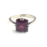 AN ART DECO 18CT WHITE GOLD AND AMETHYST RING Having a single square cut stone on a plain gold shank