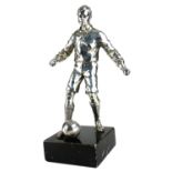 AN EARLY 20TH CENTURY SILVER PLATED STATUE OF A FOOTBALLER. (28.7cm)