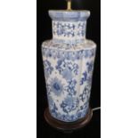 A LARGE JAPANESE BLUE AND WHITE FLORAL DECORATED VASE CONVERTED TO LAMP BASE.