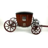 A MID 20TH CENTURY LEATHER AND CHROME TABLE CARRIAGE In the form a Royal coach, with chrome