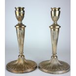 A PAIR OF 20TH CENTURY CLASSICAL FORM CANDLESTICKS Fluted form with oval base, hallmarked London,