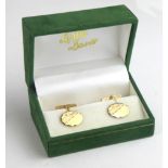 A CASED PAIR OF 9CT GOLD GENT?S OVAL CUFFLINKS With engraved decoration, in a fitted velvet lined