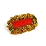 A 19TH CENTURY YELLOW METAL AND CORAL BROOCH Together with a rectangular cut coral bar, edged with a