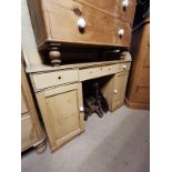 A VICTORIAN PINE WASHSTAND With galleried back above three long drawers and cupboards. (120cm x 48cm