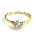 AN EARLY 20TH CENTURY 18CT GOLD AND DIAMOND SOLITAIRE RING Having a single round cut diamond on