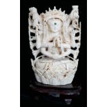 A 19TH/20TH CENTURY CARVED IVORY STATUE OF A TEN ARMED GODDESS On later hardwood stand. (13.4cm)