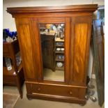 A VICTORIAN MAHOGANY WARDROBE With a single mirrored door above drawer. (130cm x 52cm x 191cm)