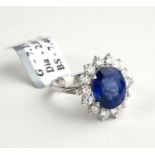 AN 18CT WHITE GOLD, 7.4CT OVAL CUT SAPPHIRE AND 2.01CT ROUND BRILLIANT CUT DIAMOND RING (SIZE P).
