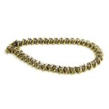 A VINTAGE 14CT GOLD AND DIAMOND TENNIS BRACELET Having a single row of round cut diamonds in a