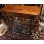 A REGENCY MAHOGANY AND LINE INLAID FOLD OVER CARD TABLE Raised on square tapering legs. (99cm x 45cm