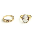 A 9CT GOLD, RUBY AND DIAMOND RING TOGETHER WITH A YELLOW METAL CAMEO RING Having an arrangement of