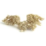 AN UNUSUAL VICTORIAN YELLOW METAL, SEED PEARL AND DIAMOND BIRD BROOCH Having an arrangement of