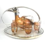 A STYLISH ART DECO SILVER PLATED TABLE DRINKING SET, TO INCLUDE AN AMBER GLASS CARAFE FORMED AS A