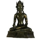 A CHINESE BRONZE FIGURE OF BUDDHA SAKYAMUNI In a seated pose with one hand open and one closed. (