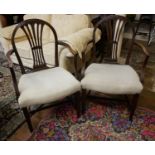 A PAIR OF 19TH CENTURY HEPPLEWHITE STYLE MAHOGANY ARMCHAIRS With a pierced splat back with carved