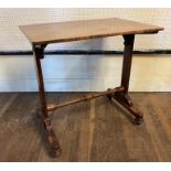 A VICTORIAN ROSEWOOD SIDE TABLE The rectangular top raised on square columns joined by turned