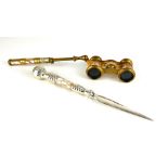 A PAIR OF 19TH CENTURY FRENCH GILT BRASS AND MOTHER OF PEARL OPERA GLASSES Having a telescopic