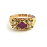 A VICTORIAN 15CT GOLD, EMERALD, SEED PEARL AND PASTE SET RING The central pink paste stone carved