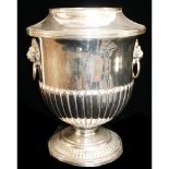 AN EARLY 20TH CENTURY SILVER PLATE ON COPPER WINE BOTTLE COOLER Classical form with twin lion mask