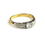 AN EARLY 20TH CENTURY 18CT GOLD AND DIAMOND RING Having a single round cut diamond in a geometric