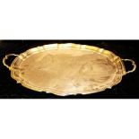 AN EARLY 20TH CENTURY SILVER PLATED OVAL SERVING TRAY With twin handles with piecrust edge, marked