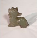 A CHINESE CARVED JADE FIGURE OF A DRAGON In recumbent pose 17cm high
