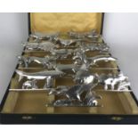 JB OF PARIS, A CASED SET OF FRENCH ART DECO HEAVY SILVER PLATED KNIFE RESTS IN THE FORM OF FISH,
